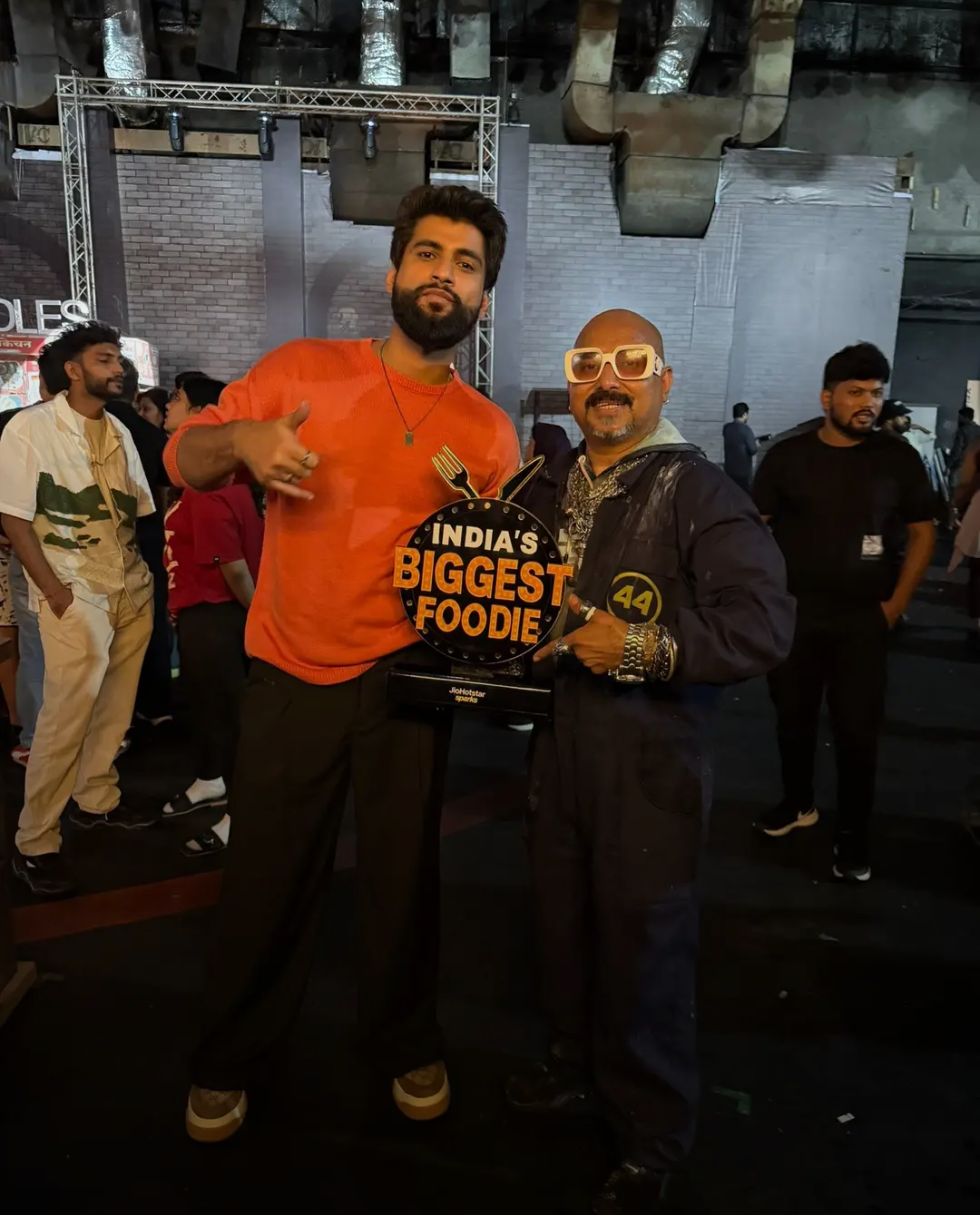 Ulhas Kamathe holding a chicken leg piece